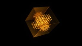 A glowing golden cube in darkness
