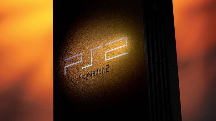A promotional shot of the PlayStation 2 showing the console looming monolith-like against a fiery red sky.