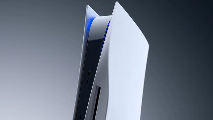 A side-on view of a vertical PS5 with the light bar glowing blue, on a grey background.