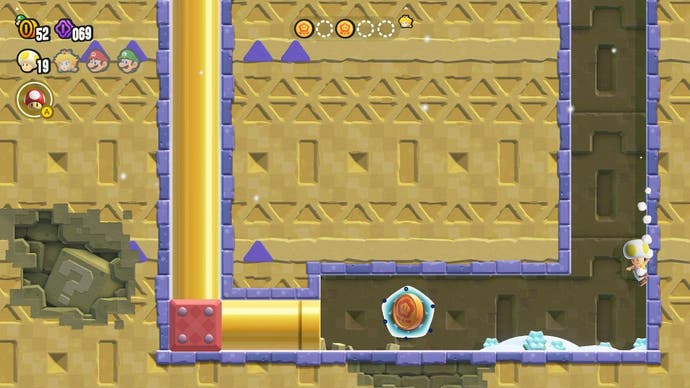 Toad slides down a tunnel to find a hidden item in Super Mario Bros Wonder