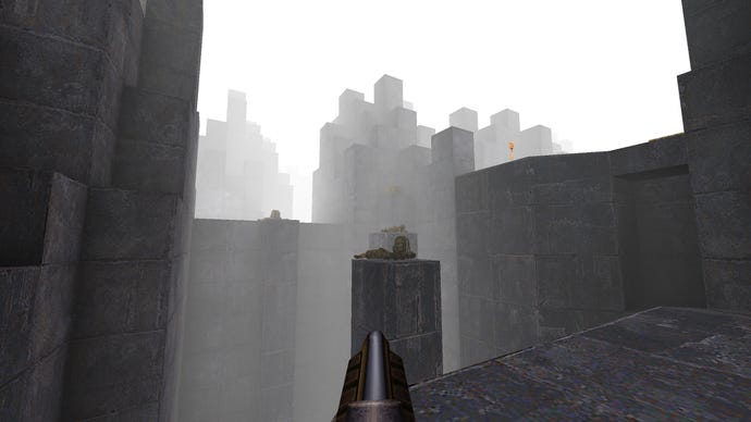 Exploring concrete hell in a screenshot from Quake's Brutalist Jam 2 map pack.
