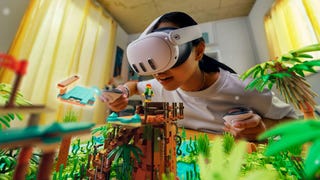 A child, wearing a Meta Quest 3 headset, plays with virtual Lego blocks, courtesy of a VR-enabled version of Lego Bricktales.