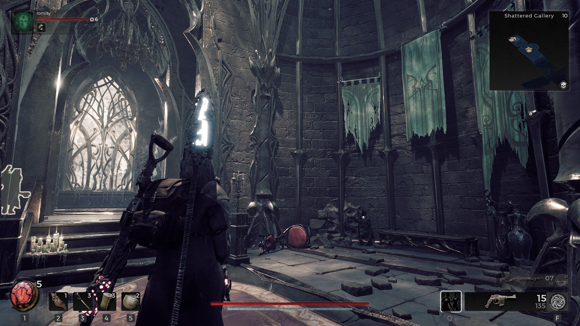 The ruins of a once-great castle in Remnant 2. Banners hang in tatters and rubble litters the ground.