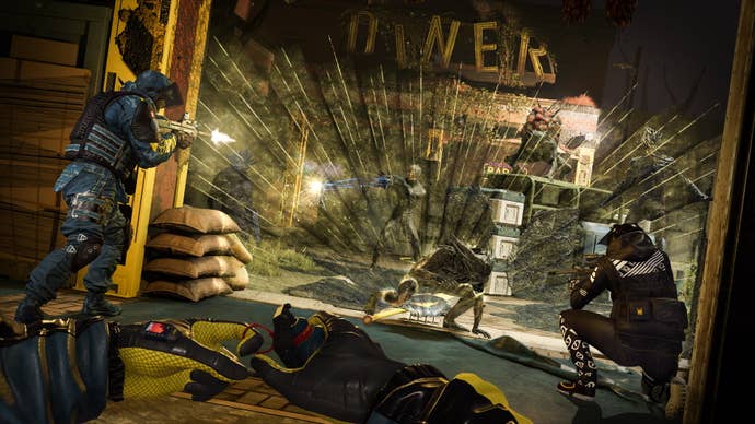 Two operators fire on a group of Archaens as another pulls the pin on a grenade in Rainbow Six: Extraction.