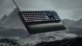 The Razer Huntsman V2 Analog keyboard in front of a rocky landscape