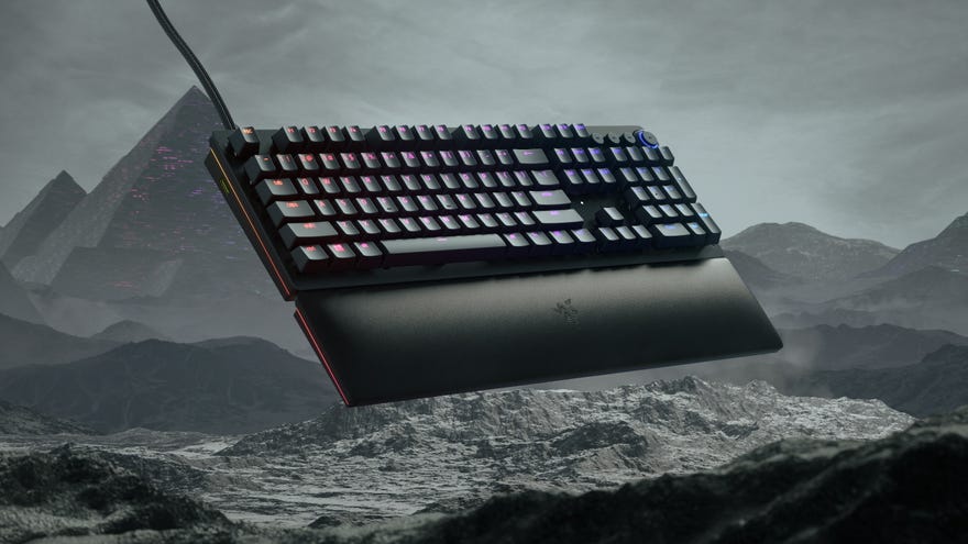 The Razer Huntsman V2 Analog keyboard in front of a rocky landscape