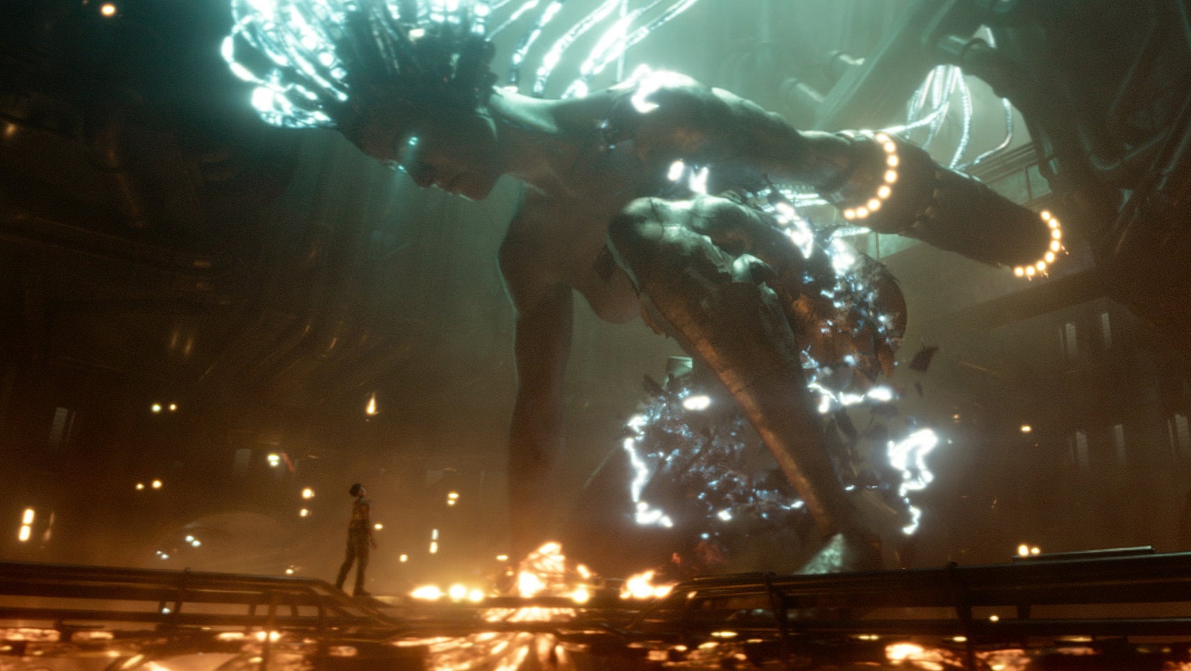 A still from the Rebel Moon director's cut of a giant robotic woman connected to various glowing wires looking down at someone. - 1