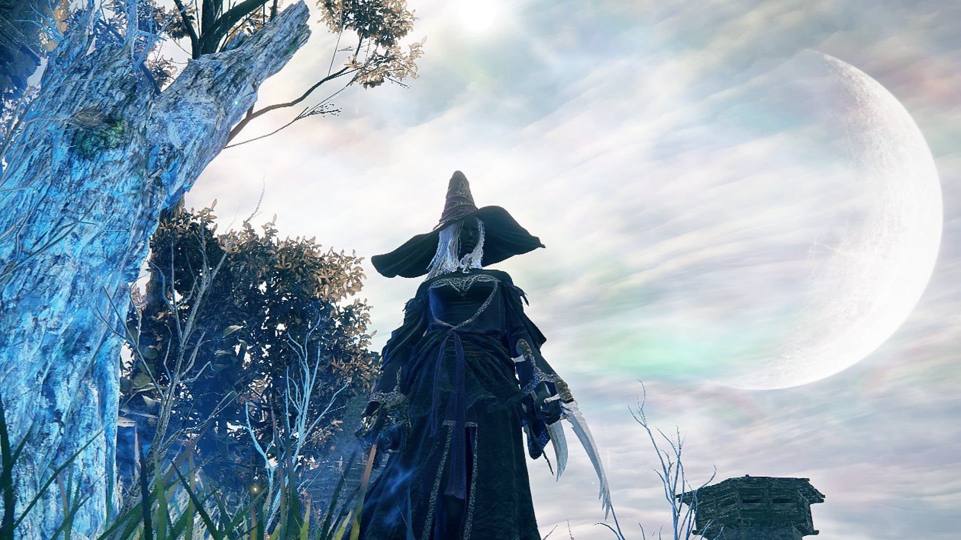 Recluse stands by a glowing blue tree that recovers her FP in Elden Ring: Nightreign. - 7