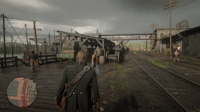 Arthur Morgan walking along the Saint Denis Docks in Red Dead Redemption 2.