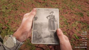 A player looks at a black and white photograph of the Black Belle gunslinger in Red Dead Redemption 2.