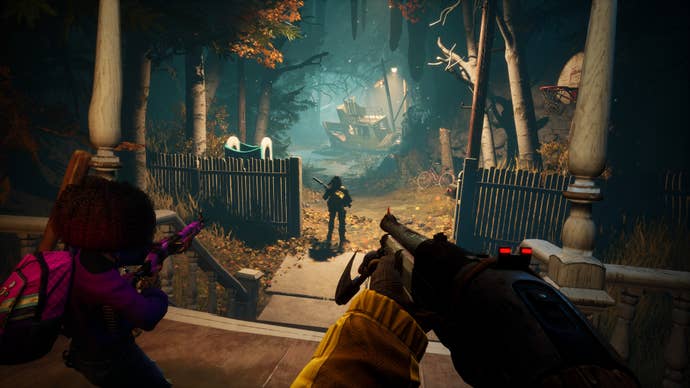 Three players stare down a spooky forest path in Redfall.
