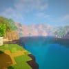 A screenshot of a river in Minecraft, with some trees on either side of the bank and a hill in the distance, taken using RedHat shaders.