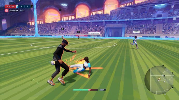 Two footballers vie for power of the ball.