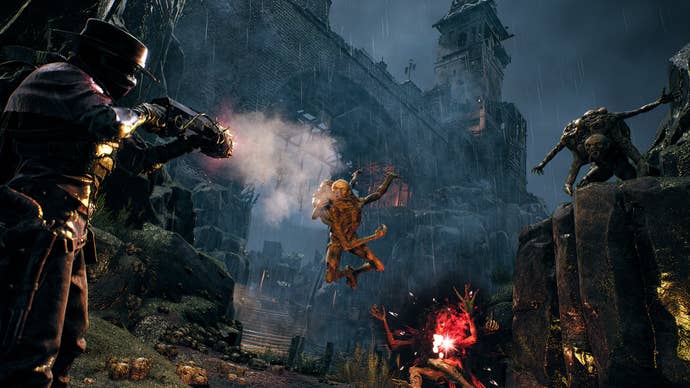 A screenshot of Remnant 2’s The Awakened King DLC showing a player attacking seemingly amphibious enemies while an imposing castle looms overhead.