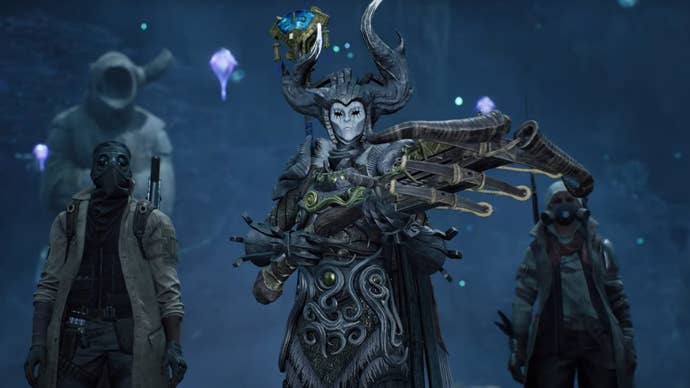 A player clad in druidic gear and wielding a crossbow is flanked by two other players in Remnant 2’s The Forgotten Kingdom expansion.