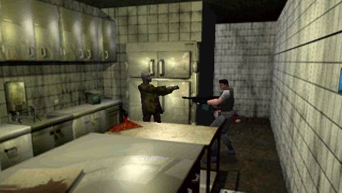 Chris Redfield points a shotgun at a zombie in a kitchen.