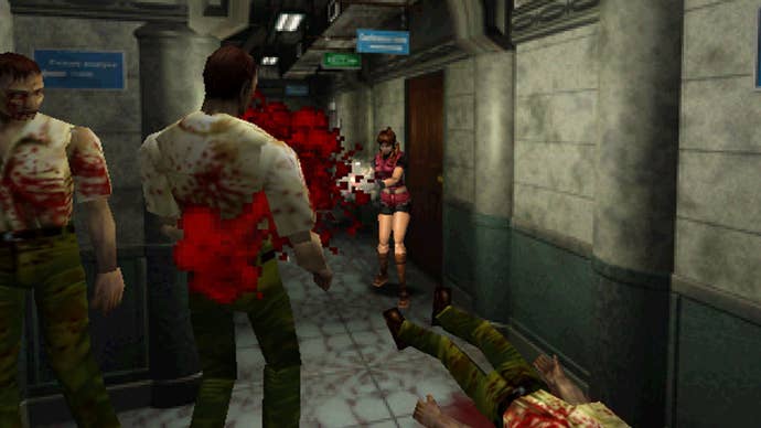Claire Redfield fires a gun at a zombie in a corridor of a police department.