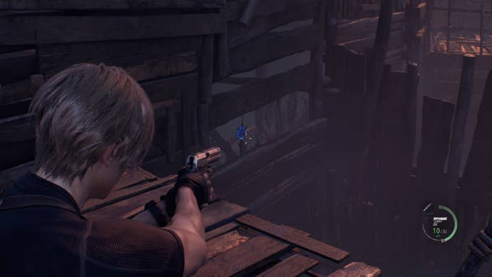 A blue medallion under a wooden structure in Resident Evil 4.