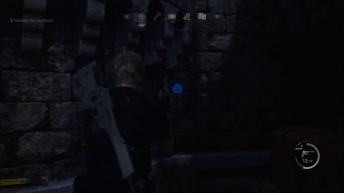 A blue medallion hidden in a small corner of the Castle Gate area in Resident Evil 4