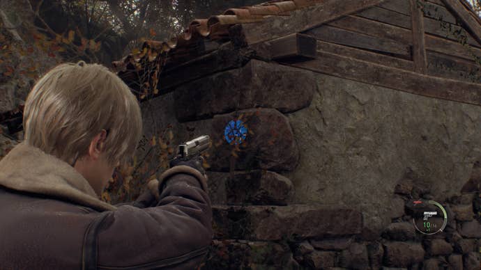 A blue medallion on the side of a hut in Resident Evil 4