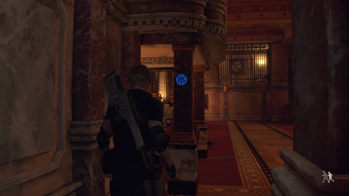 Leon Kennedy standing next to a blue medallion in the back corner of the Gallery in Resident Evil 4