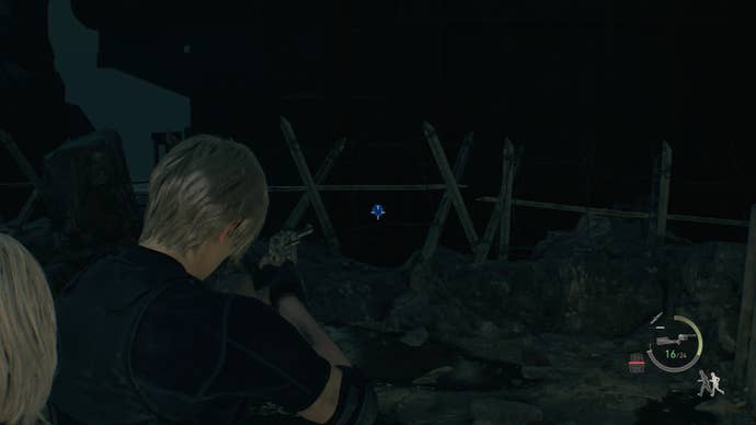 Leon Kennedy aiming his pistol at a blue medallion off the side of the Cargo Depot in Resident Evil 4