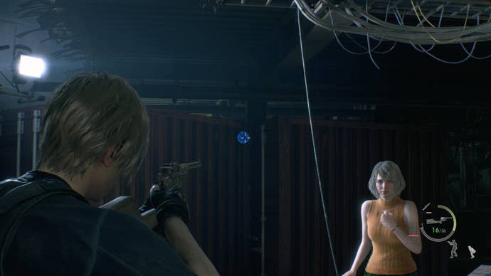 Leon Kennedy and Ashley standing next to a blue medallion hung on some shipping containers in the Cargo Depot in Resident Evil 4