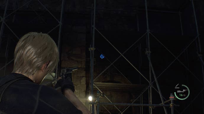 A blue medallion inside some scaffolding in the Cliffside Ruins in Resident Evil 4