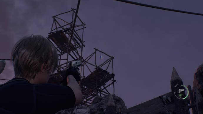 A blue medallion high up on some scaffolding in Resident Evil 4.