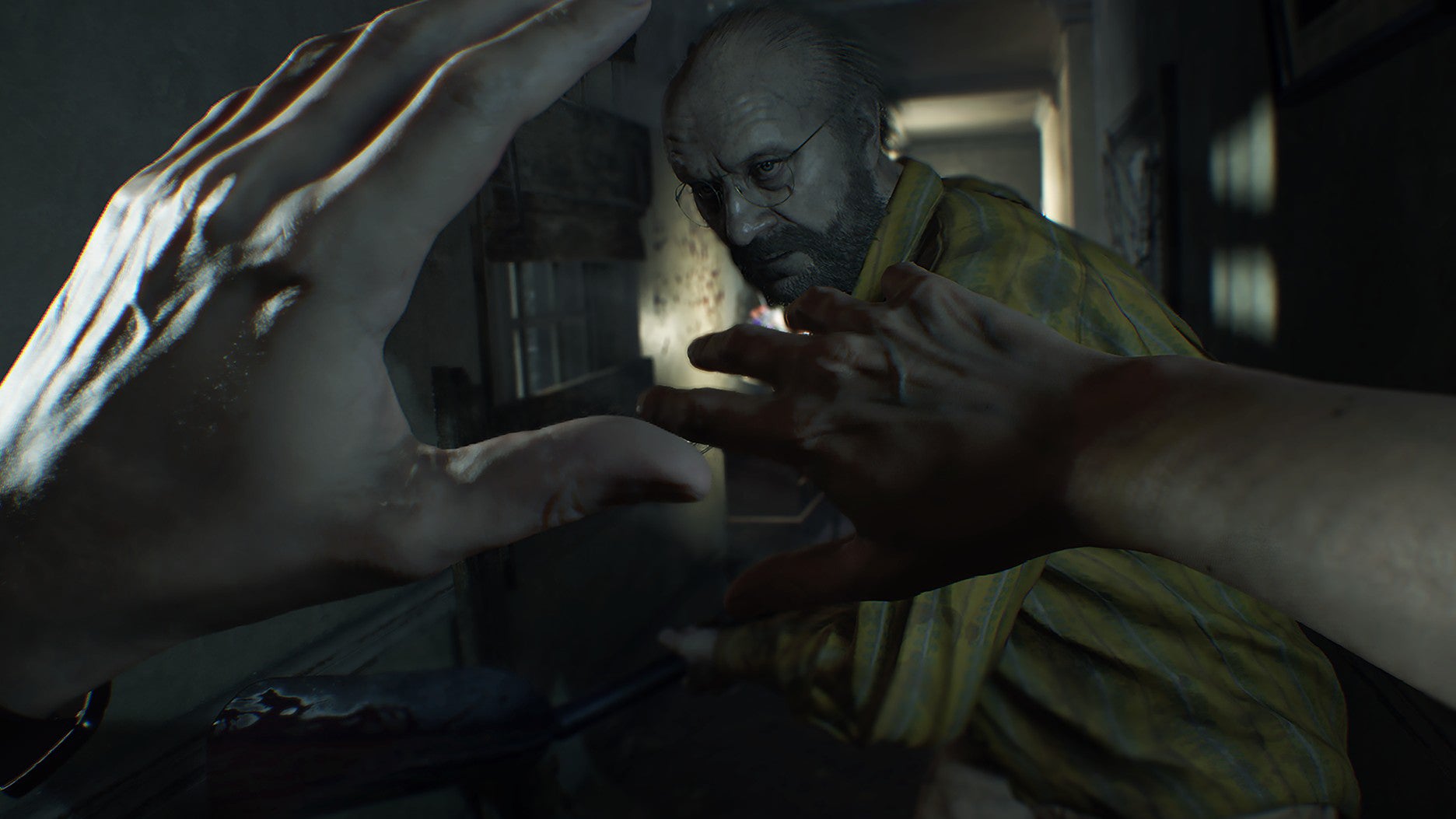 Ethan Winters holding his hands up trying to protect himself from Jack Baker in Resident Evil 7.