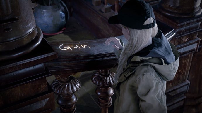 Rose looks at a bannister with the word ‘gun’ written on it in glowing letters in Resident Evil Village’s Shadows Of Rose DLC