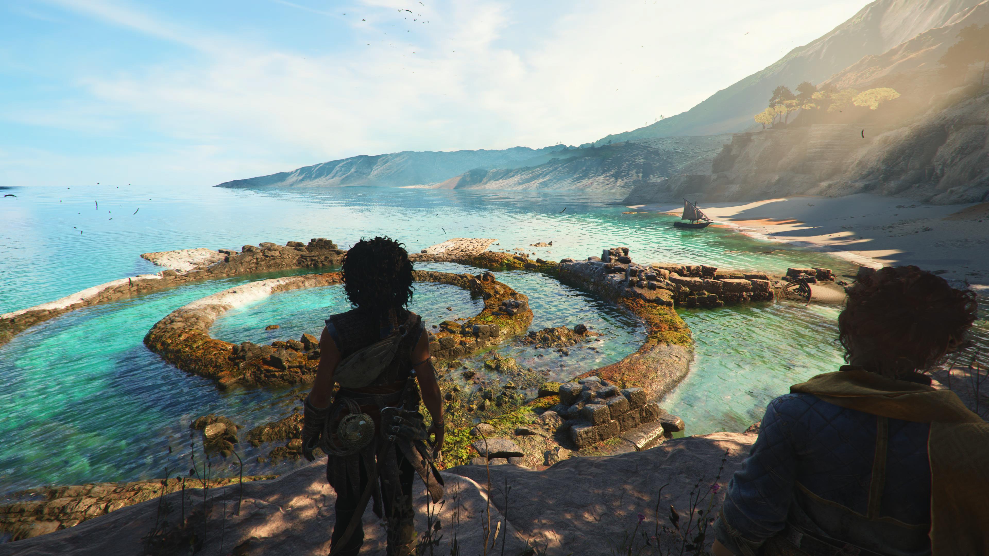 Resonance: A Plague Tale Legacy screenshot showing Sophia and Leni looking towards a shoreline on a Minoan island. The sea is invitingly blue.