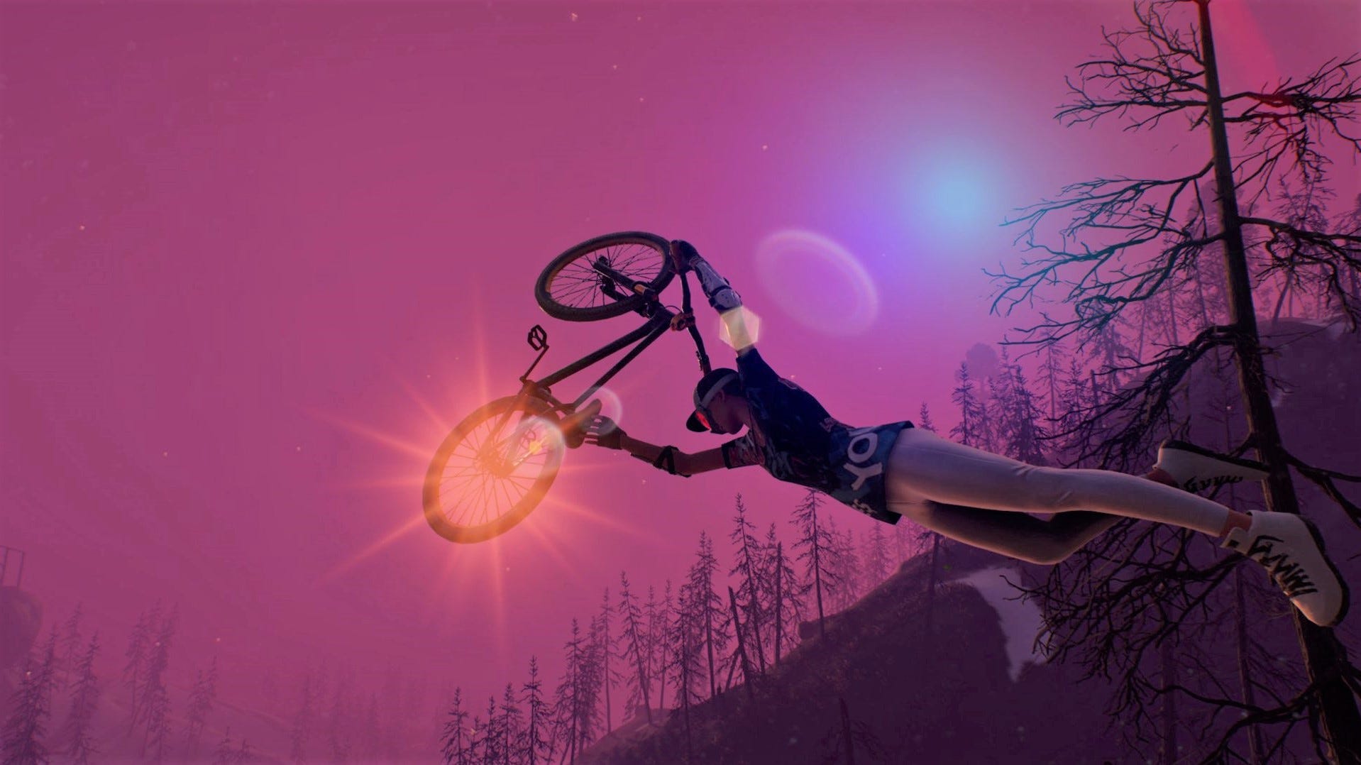 A bike held aloft above a rider's head, with burnt, bare trees providing the horizon for an otherworldly purple sky.