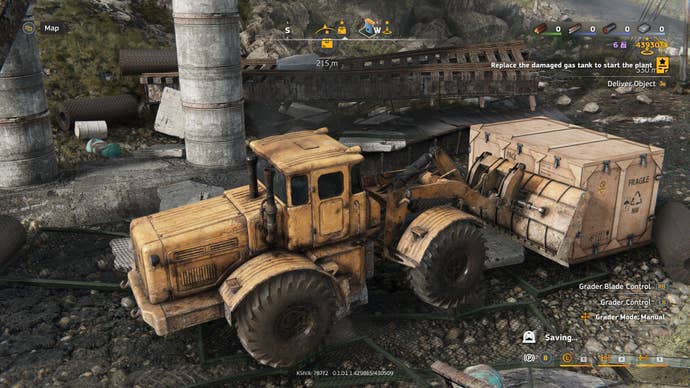 A bulldozer attempts to interruption a large woody crate.