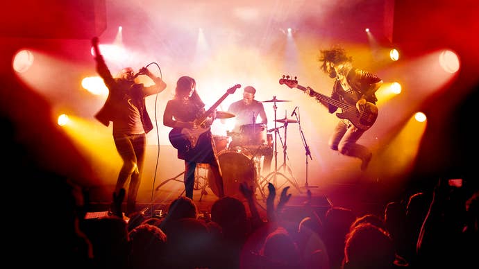 Rock Band 4 artwork featuring a band on stage playing instruments in front of a crowd.