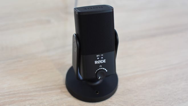 The Rode NT-USB Mini microphone on a desk.