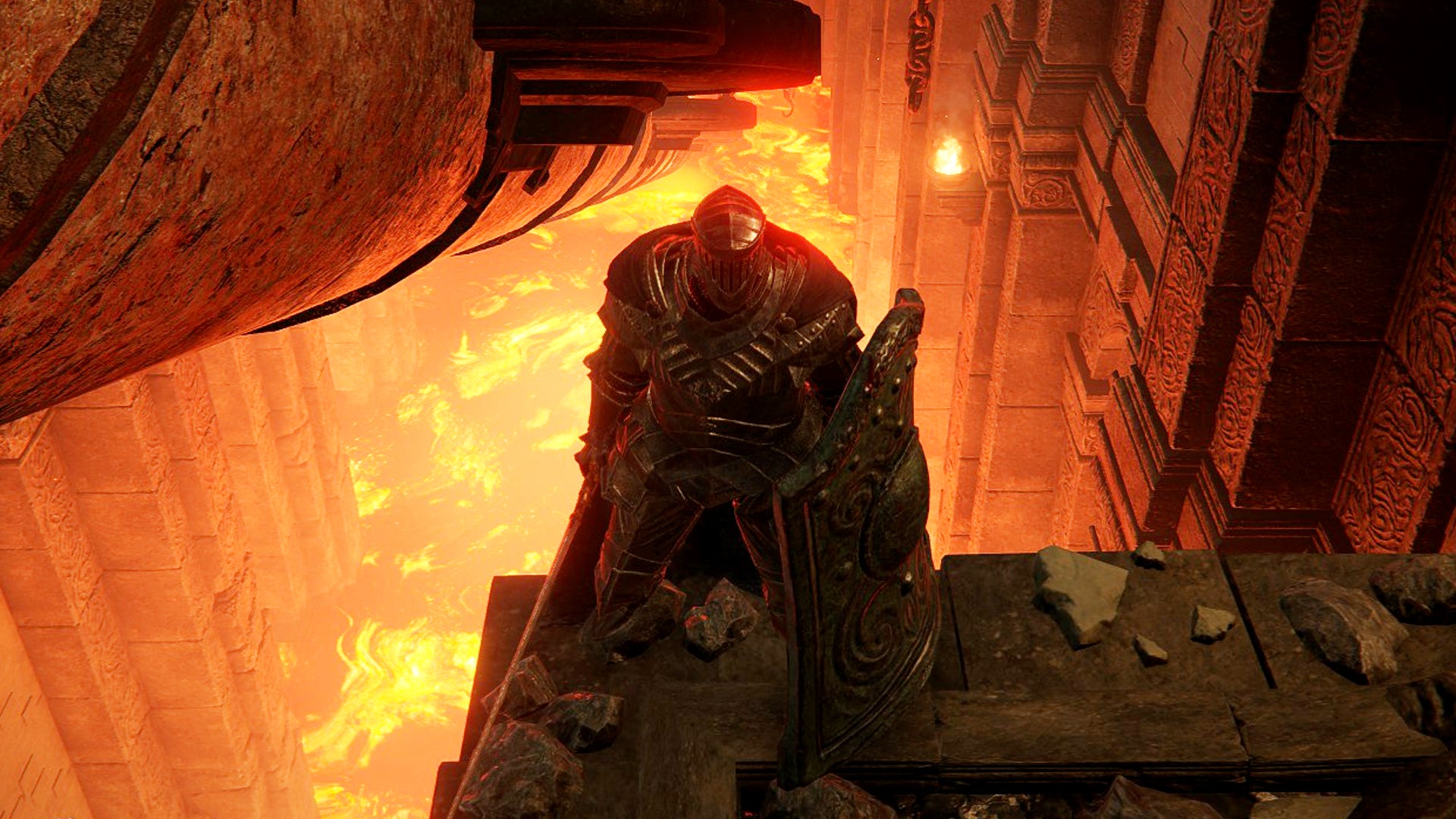 A Tarnished stands on a ledge overlooking a lava pool in the Ruined Forge Lava Intake in Elden Ring: Shadow of the Erdtree. - 1