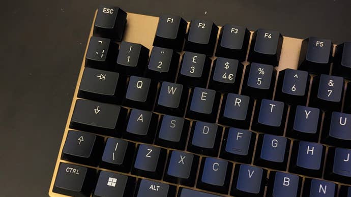 a cherry kc 200 mx keyboard with an ’s' key with lettering that looks slightly darker than that of the other keycaps