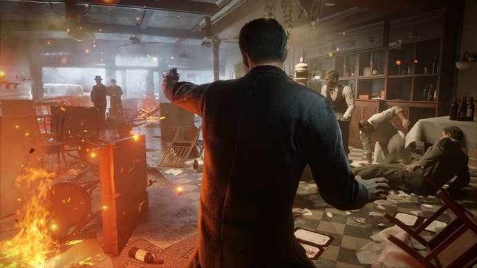 Screenshot from Mafia: Definitive Edition showing a gun fight within a burning building