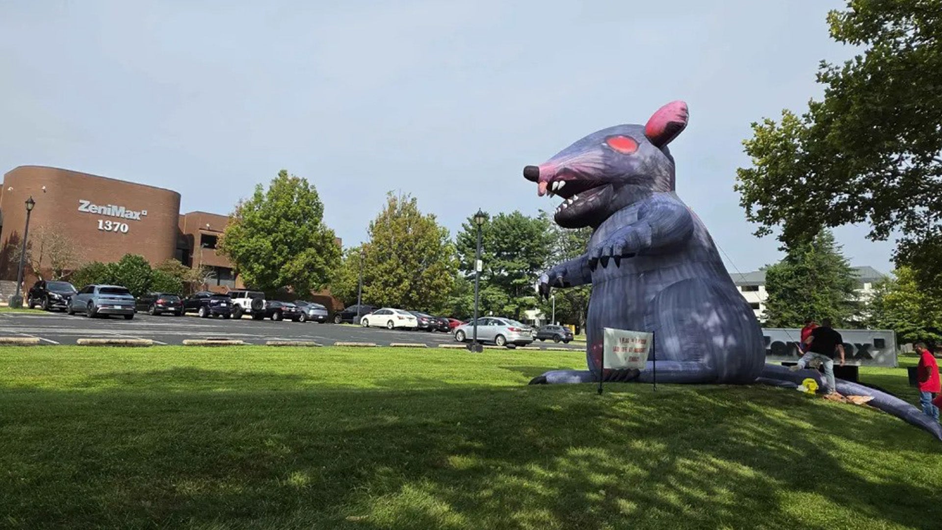 As Xbox head Asha Sharma reportedly visits Bethesda HQ, workers put up red flags representing laid off staff and a giant inflatable rat outside