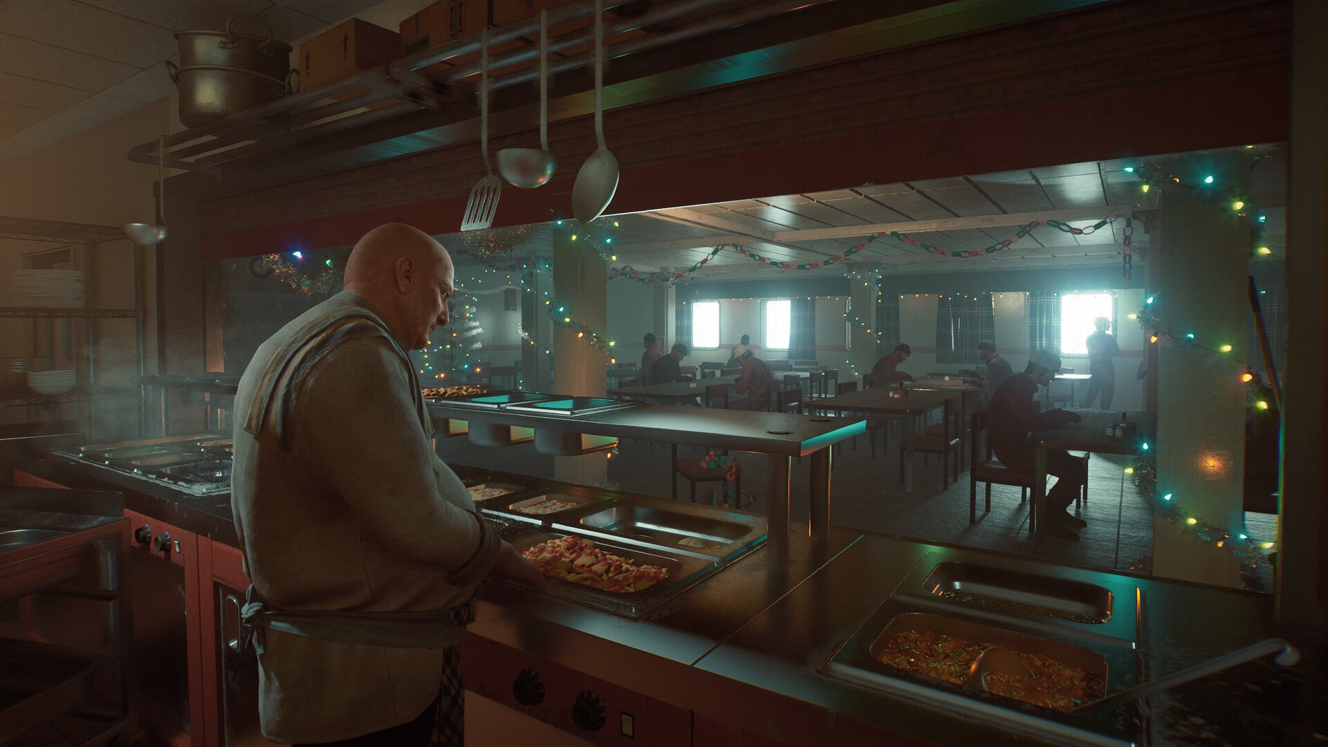 a cook serves food in a packed canteen at christmas in Still Wakes The Deep - 5