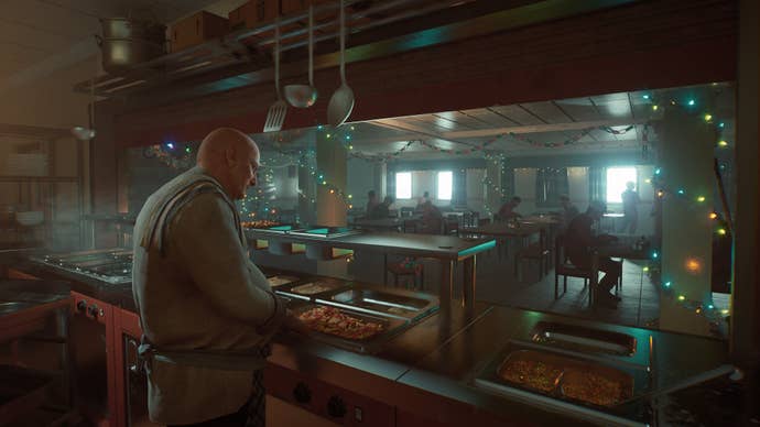 a cook serves food in a packed canteen at christmas in Still Wakes The Deep