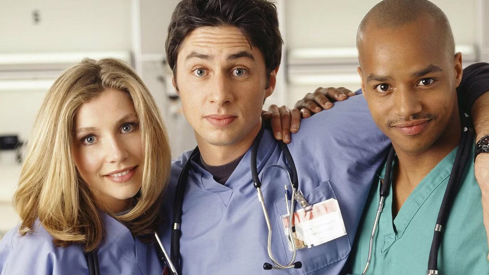 Elliot, JD, and Turk holding each other in Scrubs while looking into the camera. - 1