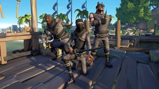 A Sea of Thieves screenshot showing three pirates posing on a dock while wearing stealthy dark clothing and headgear.