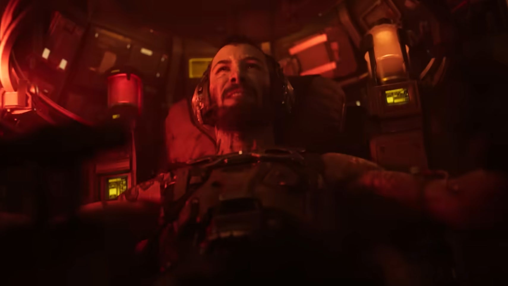 Keanu Reeves is in the cockpit of a mech suit, gritting his teeth in the Armored Core episode of Secret Level. - 1