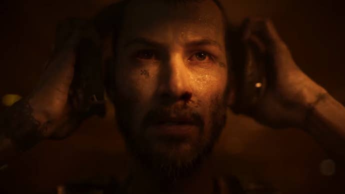 Keanu Reeves taking off headphones in Secret Level.