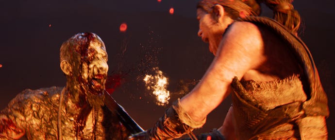 Senua cleaves a man's head in half during some extremely gory combat in Senua's Saga: Hellblade 2.