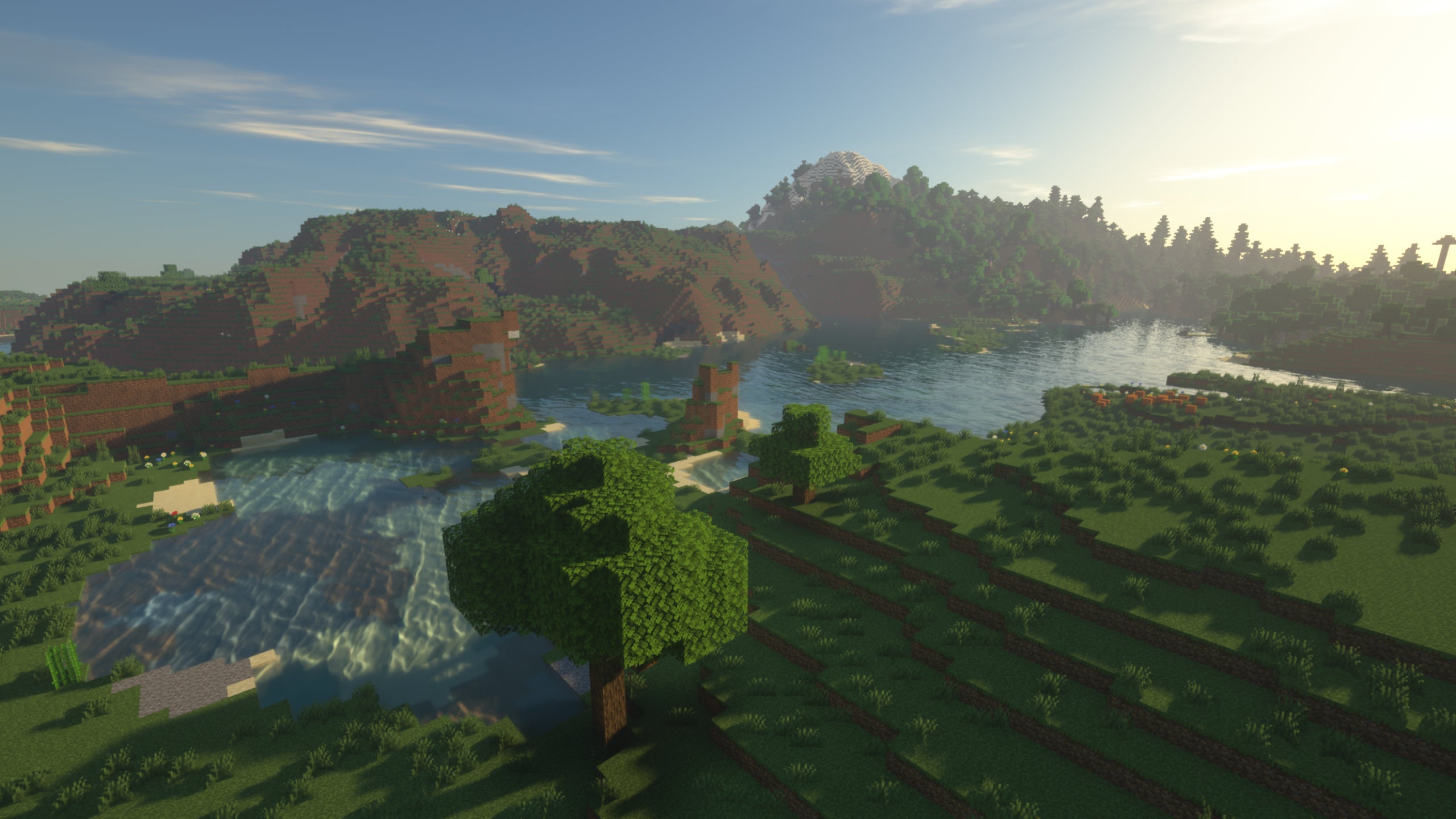 A Minecraft lake surrounded by plains and hills with SEUS Renewed shaders installed.