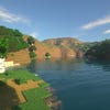 A screenshot of a river in Minecraft, with some trees on either side of the bank and a hill in the distance, taken using SEUS shaders.