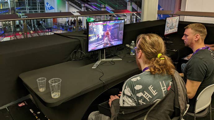 Two people playing Street Fighter 6 as VsFighting X